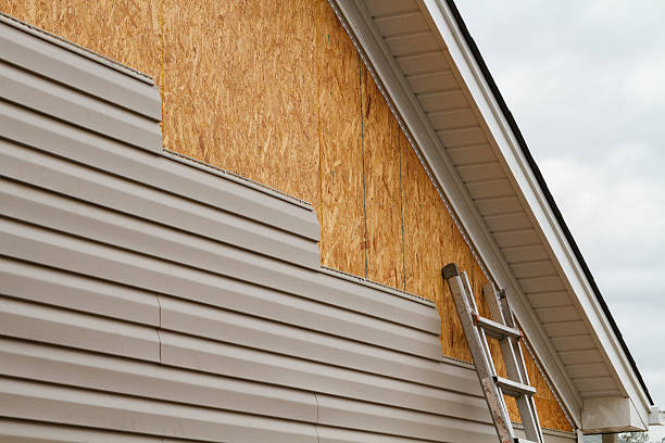 Professional Siding technician working in Marsteller, PA